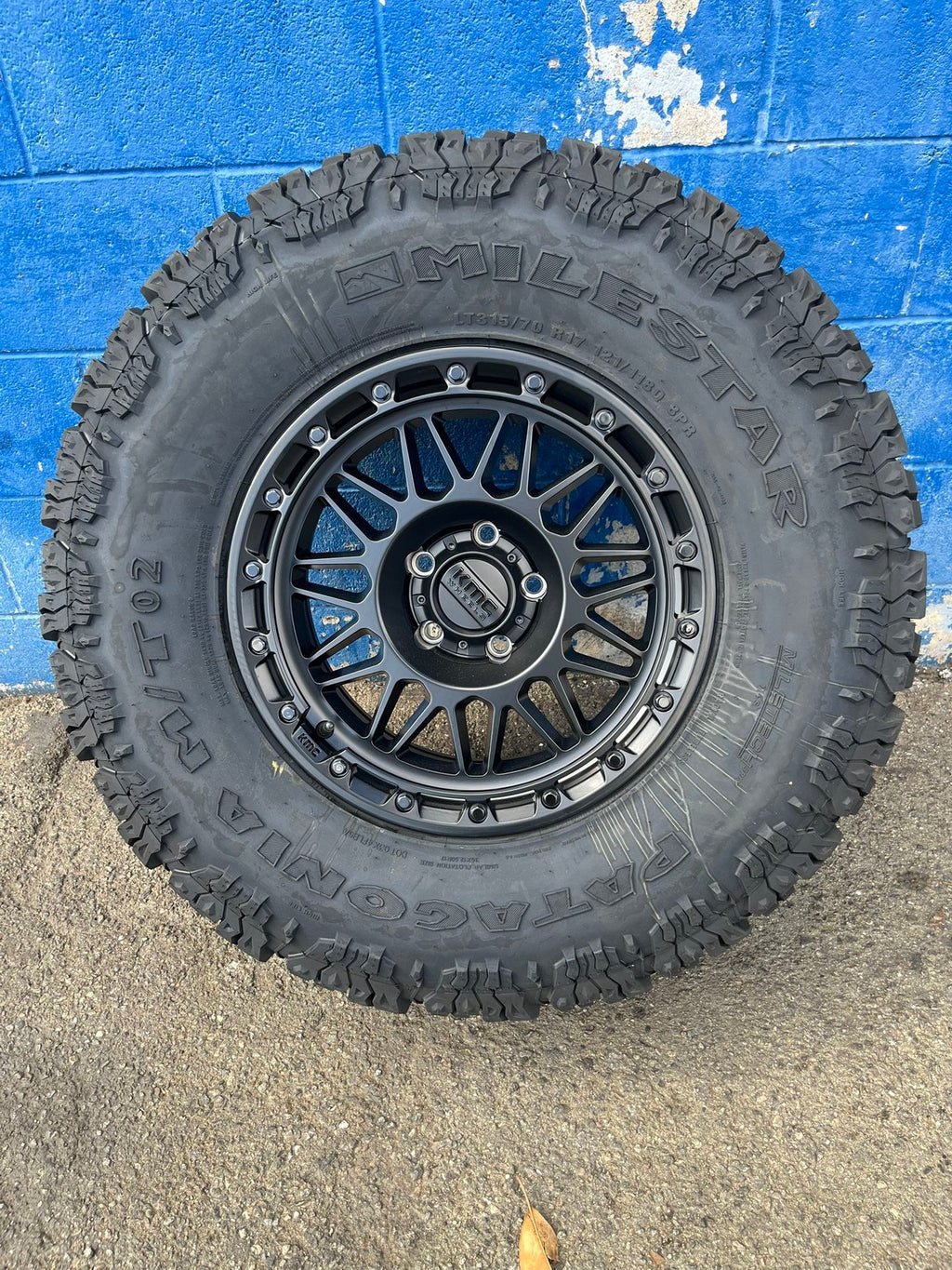 KMC KM555 Attack Wheels 17”5x5/Milestar Patagonia M/TO2 315-70-17 Matte Black